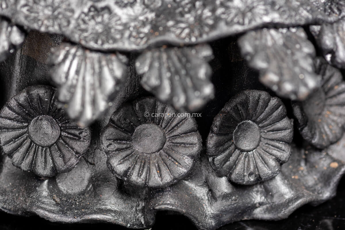Detail of Day of the dead Sculpture Black Catrina  with deer head dress and pastillage flowers on her skirt