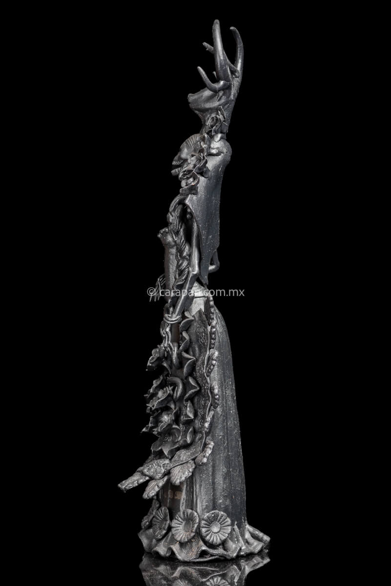 Side of Day of the dead Sculpture Black Catrina  with deer head dress and pastillage flowers on her skirt