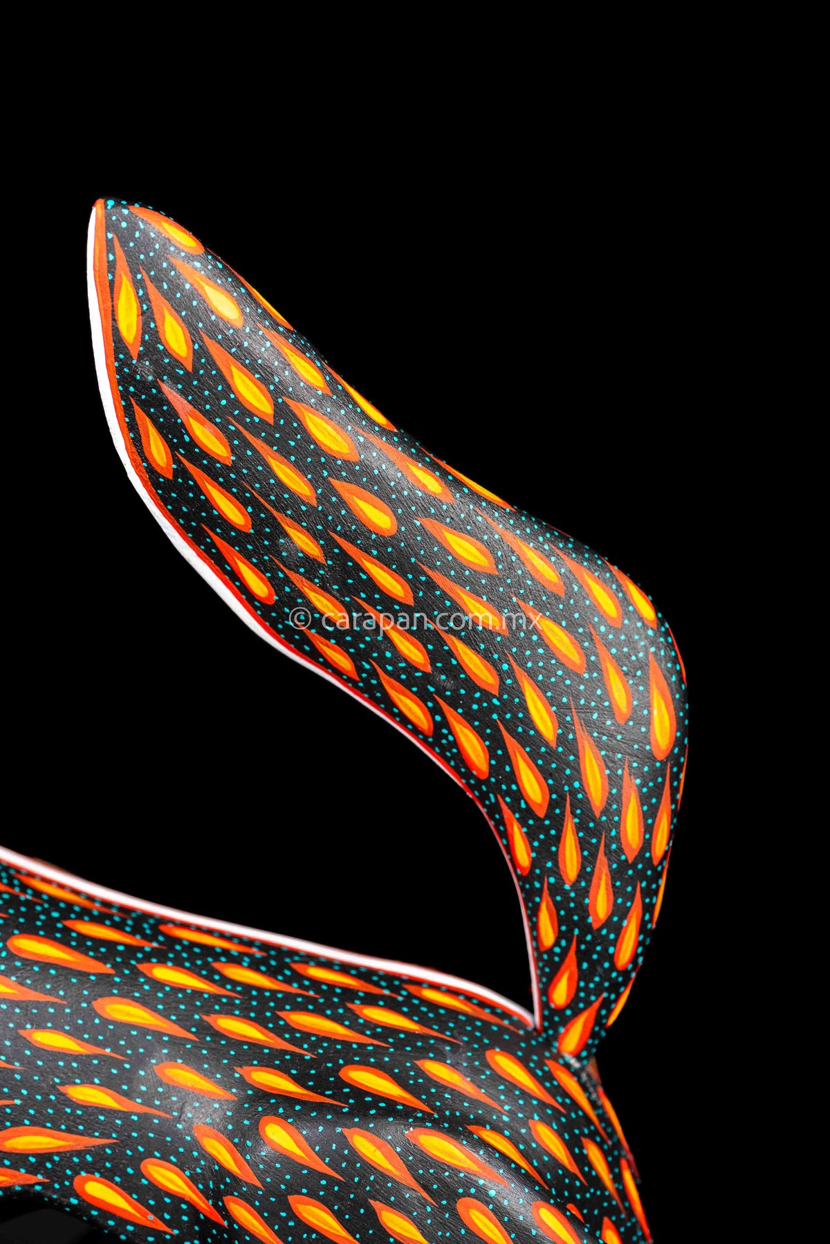 Tail of Black Horse Mexican Wood Carving Alebrije hand painted in red with orange strokes