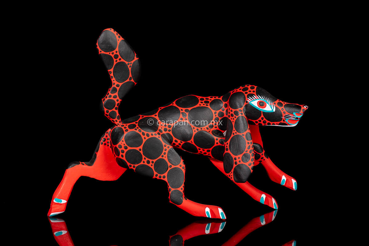 Red dog with round black patches Mexican Wood Carving hand crafted in Oaxaca, Mexico