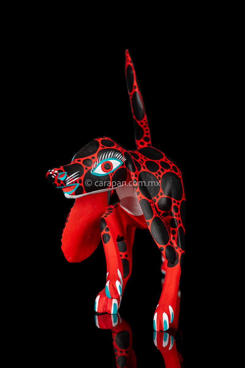 Red dog with round black patches Mexican Wood Carving hand crafted in Oaxaca, Mexico