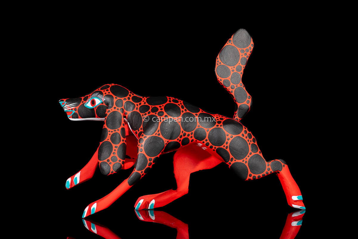 Red dog with round black patches Mexican Wood Carving hand crafted in Oaxaca, Mexico