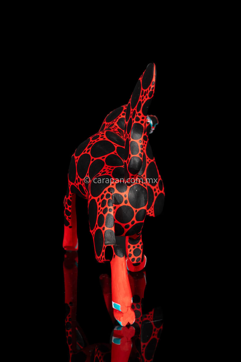 Red dog with round black patches Mexican Wood Carving hand crafted in Oaxaca, Mexico back