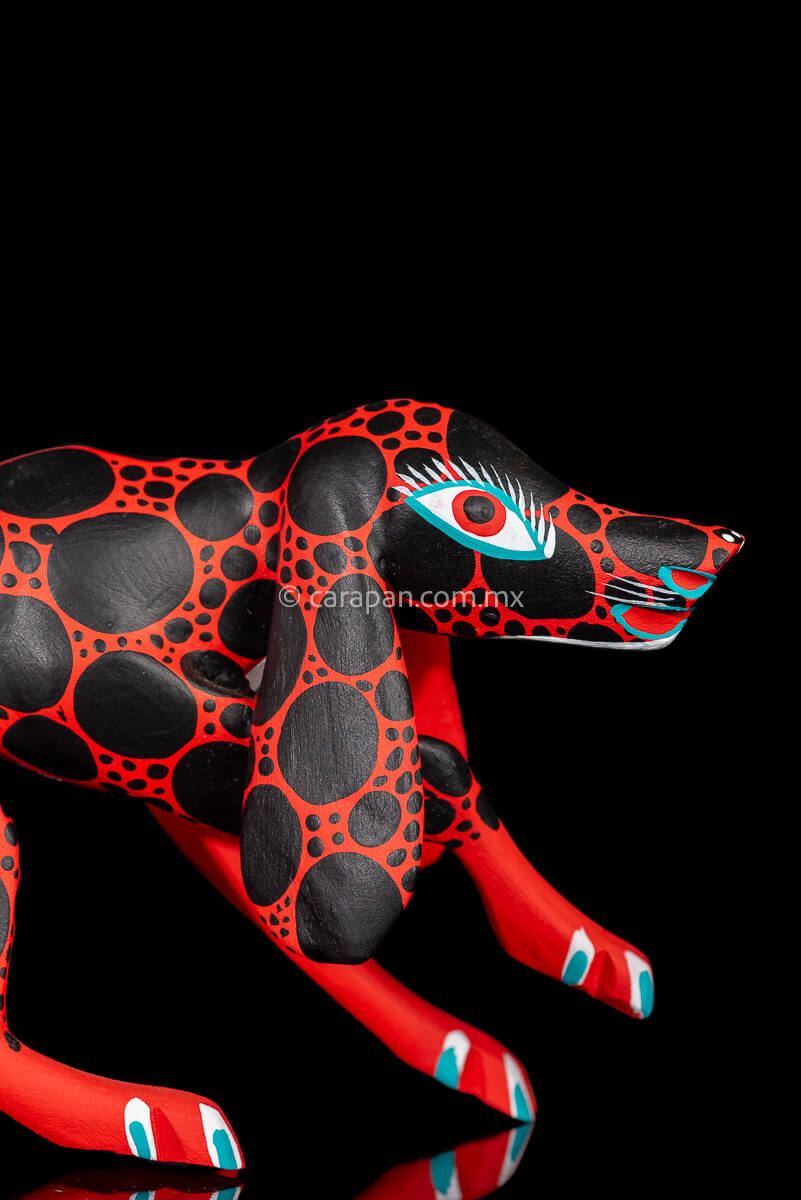 Red dog with round black patches Mexican Wood Carving hand crafted in Oaxaca, Mexico head