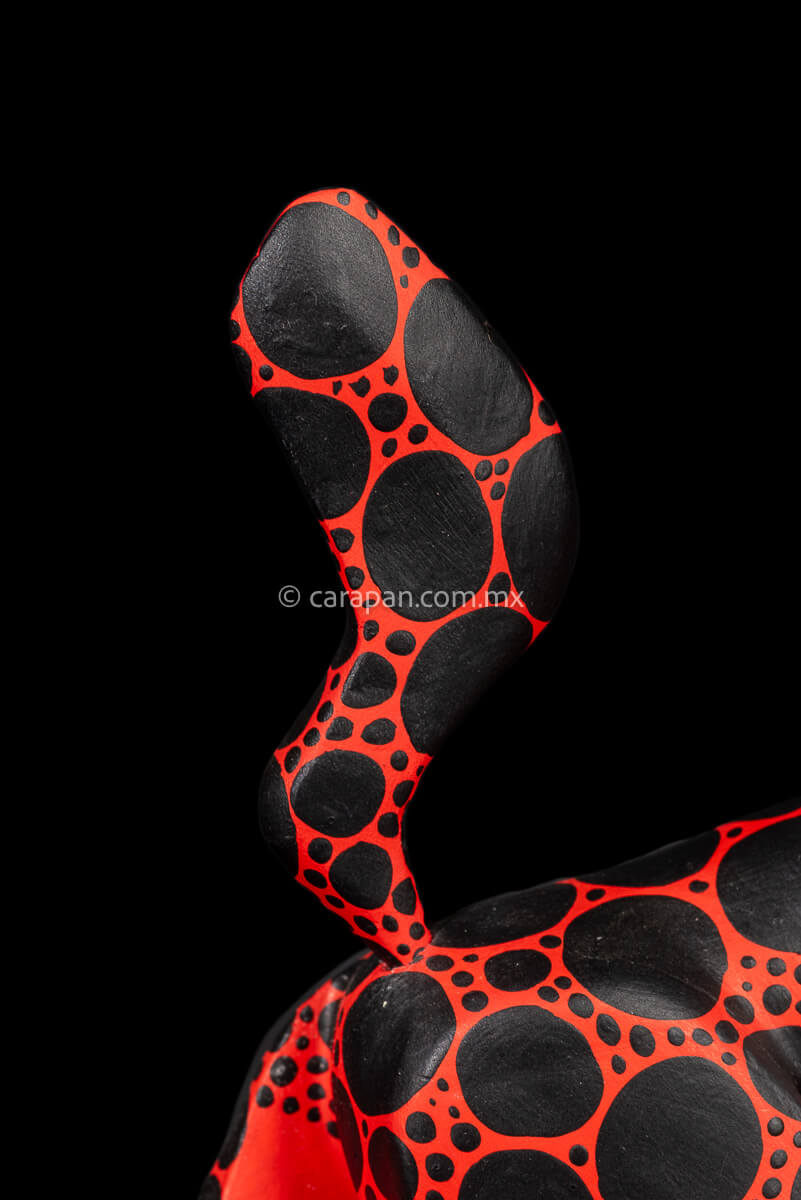 Red dog with round black patches Mexican Wood Carving hand crafted in Oaxaca, Mexico tail