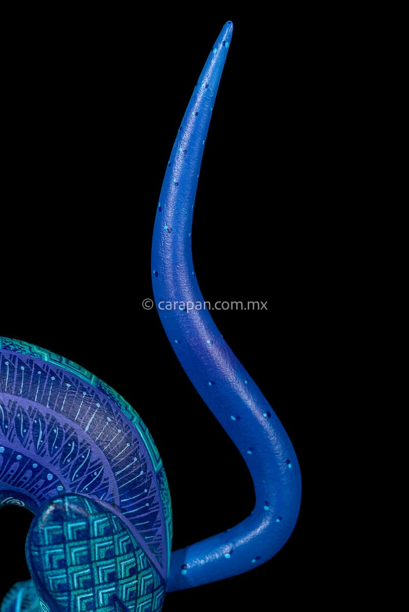 Tail of Dog Sculpture Mexican Wood Carving Hand crafted in Oaxaca & decorated with indigenous Zapotec symbols in blue
