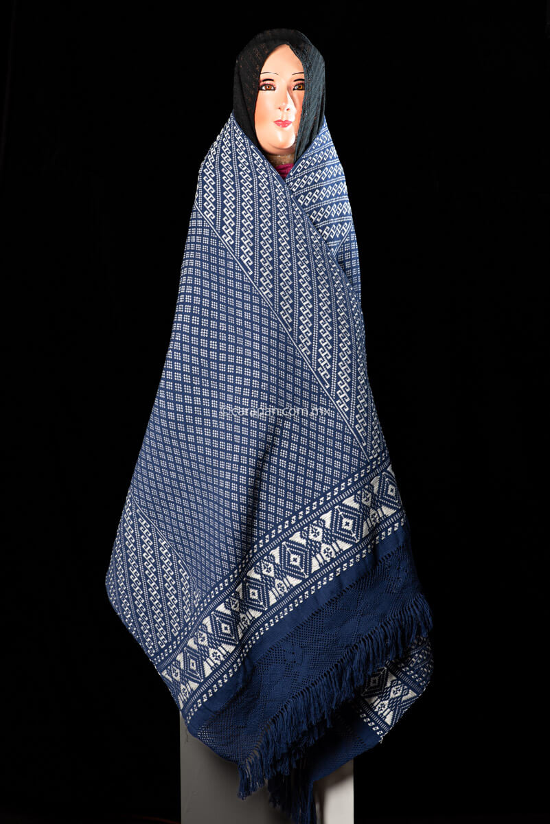 Purepecha Indigenous Textile Backstrap Loomed with mesmerizing patterns in blue and white.Reversible, in one side white dominates over blue. The other side blue dominates over white. The border is decorated with  birds and the blue fringe displays a  hand knotted openwork with flowers.