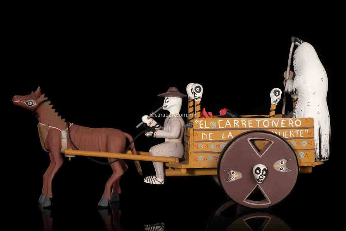 Cart pulled by a brown mule with 1 skeleton as rider & a figure representing the dead on it beside a death devil. The cart displays the legend in spanish that states "saving the world from evil" on one side & "Death's cart driver on the other side"