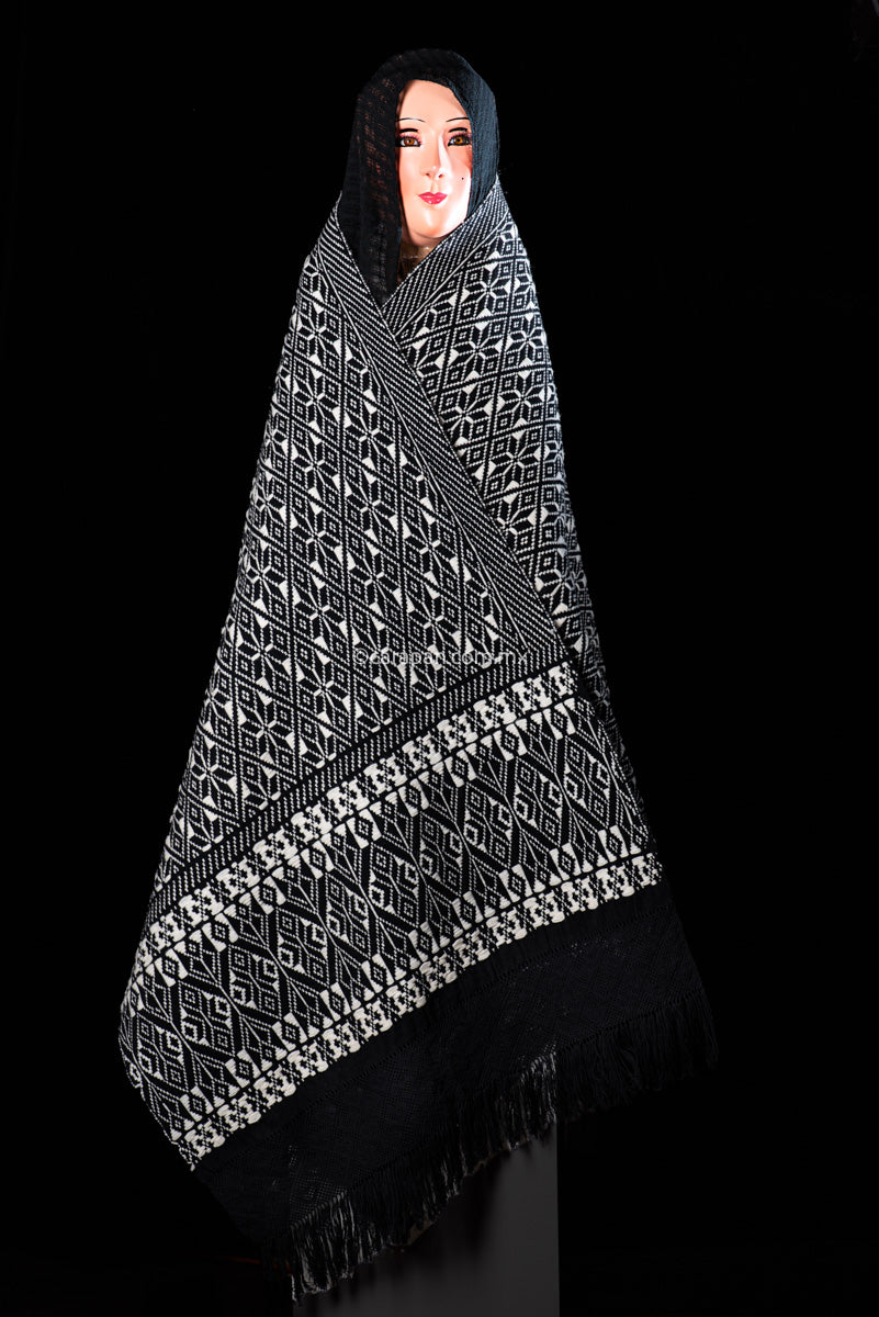 Purepecha Indigenous Textile Backstrap Loomed with mesmerizing patterns in blue and white.Reversible, in one side white dominates over black. The other side black dominates over white.  The fringe displays a  hand knotted openwork with hearts.