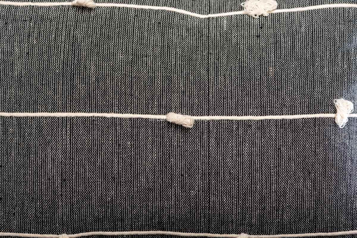 Set of 2 rectangular gray cushion covers in gray over beige jaspe and three beige horizontal stripes. Pedal loomed in Oaxaca