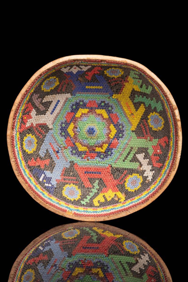 Vintage Huichol Beaded Gourd with Peyote Symbol at the center and 6 deer around it. Crafted with glass beads applied to the gourd over a layer of bees wax with no previous design.