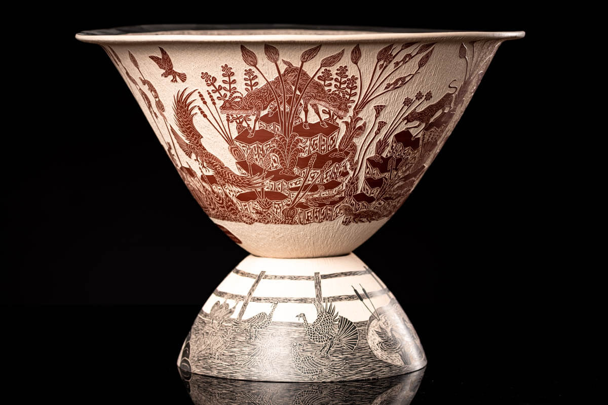 Mata Ortiz pot conic shape decorated with Mexican semi desert & Mountain creatures such as eagles, deer, rams, bats, owls, turkeys, squirrels and bears. The outside of the pot is decorated in brown over beige and the inside in black over beige. The base is also decorated in black over beige with sgraffito technique