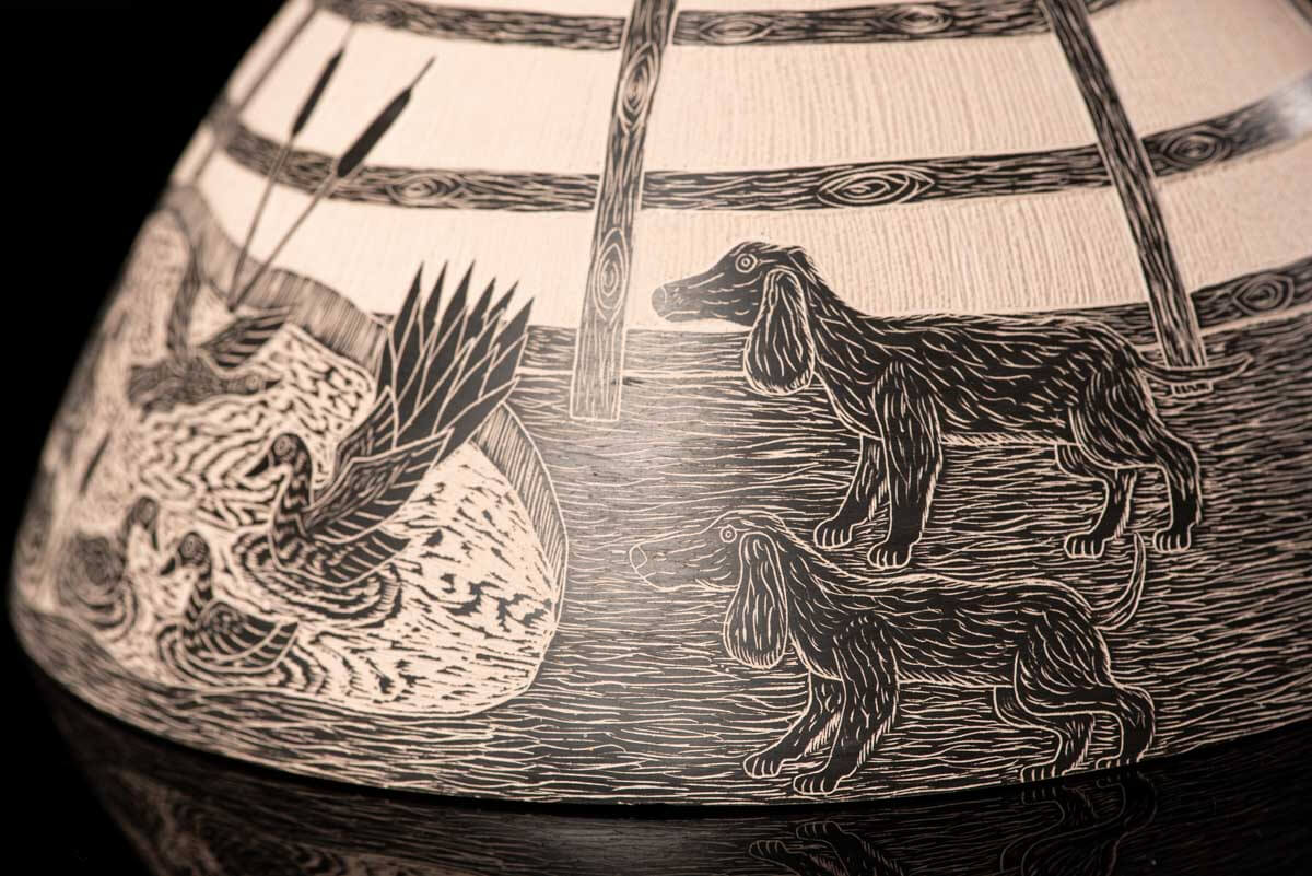 Mata Ortiz pot conic shape decorated with Mexican semi desert & Mountain creatures such as eagles, deer, rams, bats, owls, turkeys, squirrels and bears. The outside of the pot is decorated in brown over beige and the inside in black over beige. The base is also decorated in black over beige with sgraffito technique