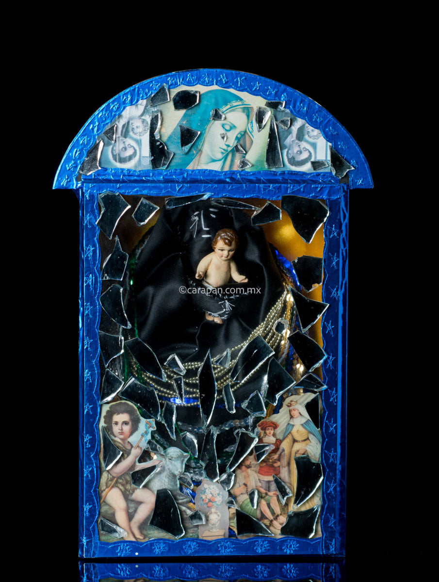 Diorama in blue with saint in black carrying baby jesus surrounded by clipping of religious images and mirror fragments. Signed 2003 By Mexican artist Alfredo Torres.