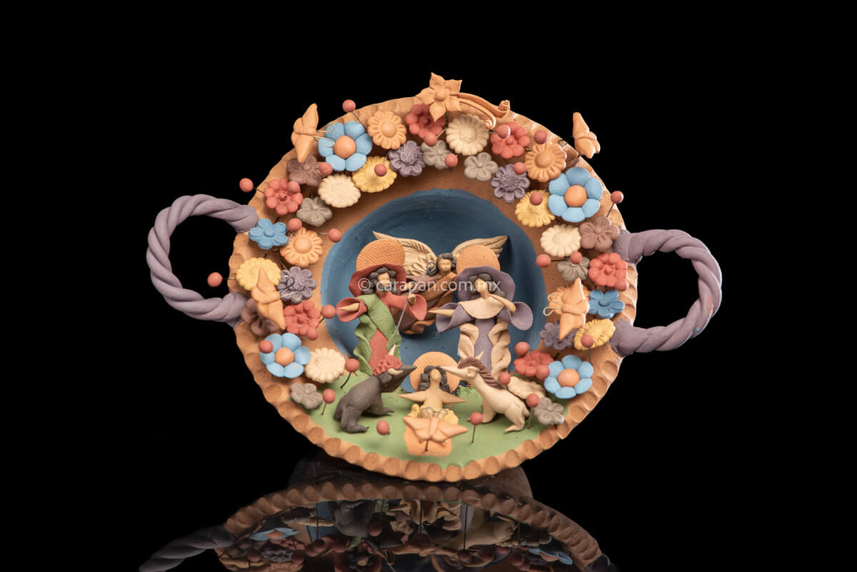 Miniature Nativity Set of Holly Family with St. Gabriel Archangel surrounded by butterflies & Flowers.