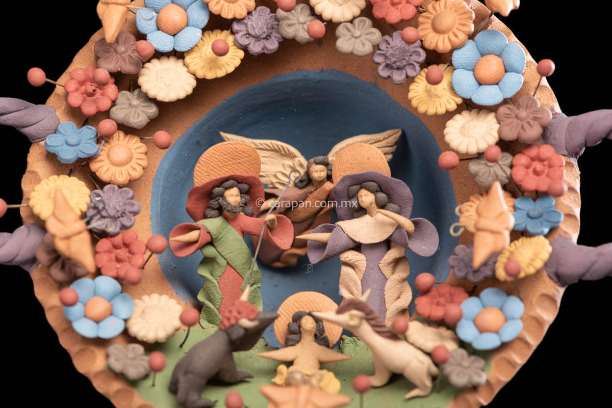 Miniature Nativity Set of Holly Family with St. Gabriel Archangel surrounded by butterflies & Flowers.