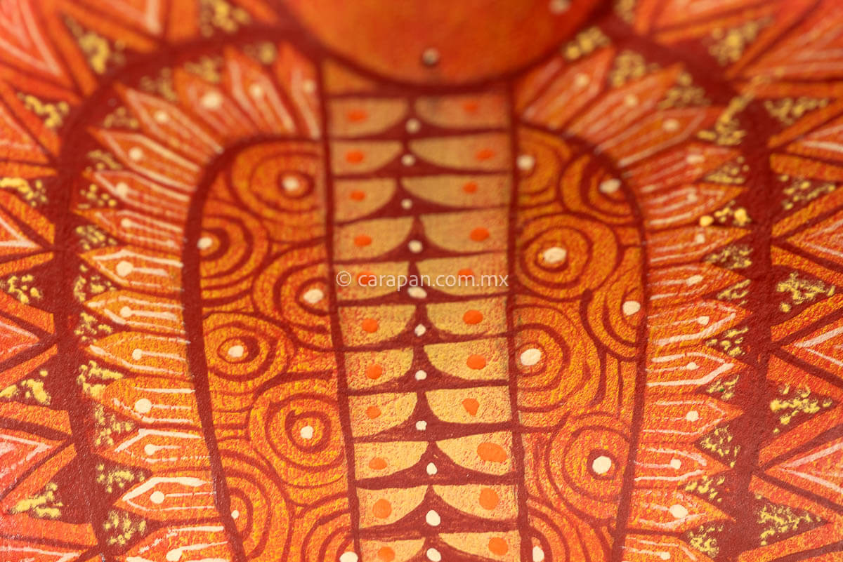 detail of Cobra wooden sculpture alebrije hand crafted in Oaxaca, decorated with indigenous zapotec symbols