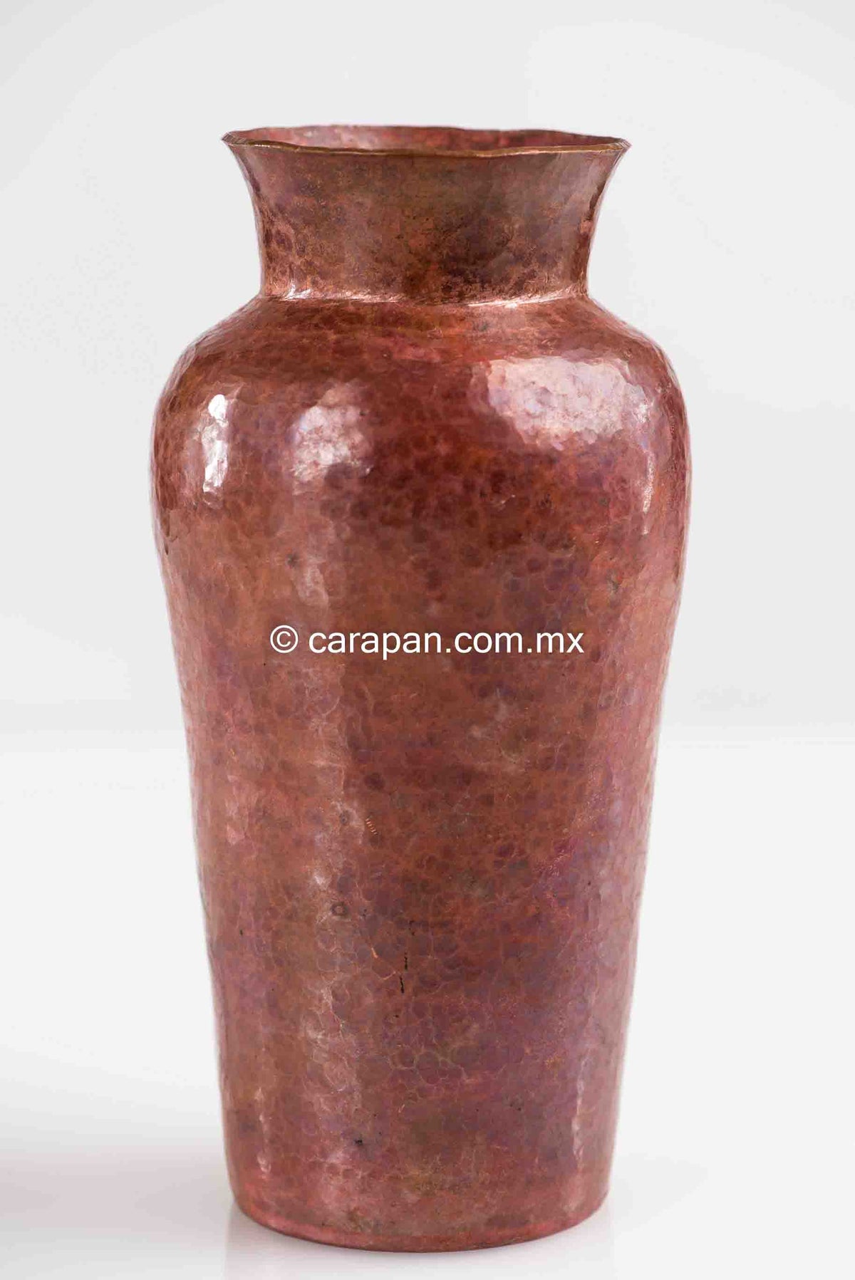 Tall round hammered copper pot folk art