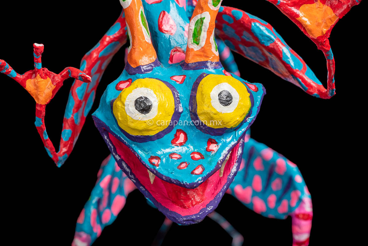 Paper Mache Alebrije dragon style blue body & orange wings close up