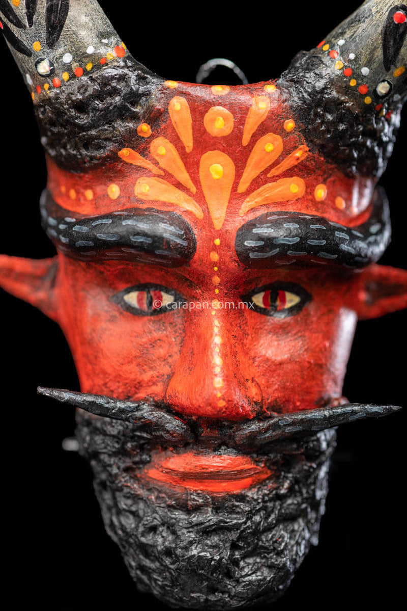 Paper Mache Mask with sharp horns beard and moustache close up