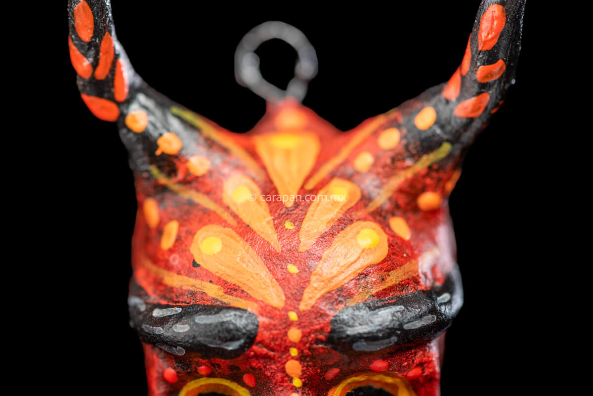 Paper Mache Smiling Devil with Moustache Painted in Red with orange strokes