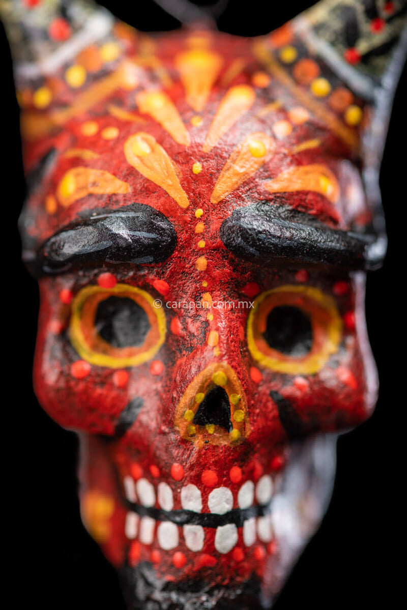 Smiling Paper Mache devil Head with White Horns Painted in red with orange strokes Zoom