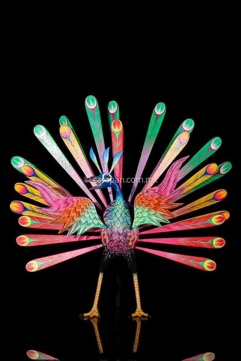 Peacock Wooden Sculpture Handcrafted in Oaxaca Mexico, hand painted displaying multiple colors wings& every feather are detachable