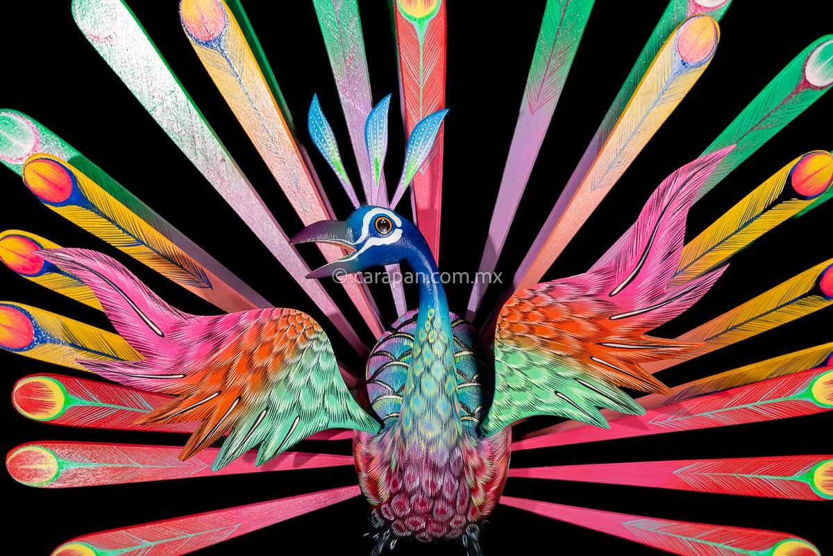Peacock Wooden Sculpture Handcrafted in Oaxaca Mexico, hand painted displaying multiple colors wings& every feather are detachable