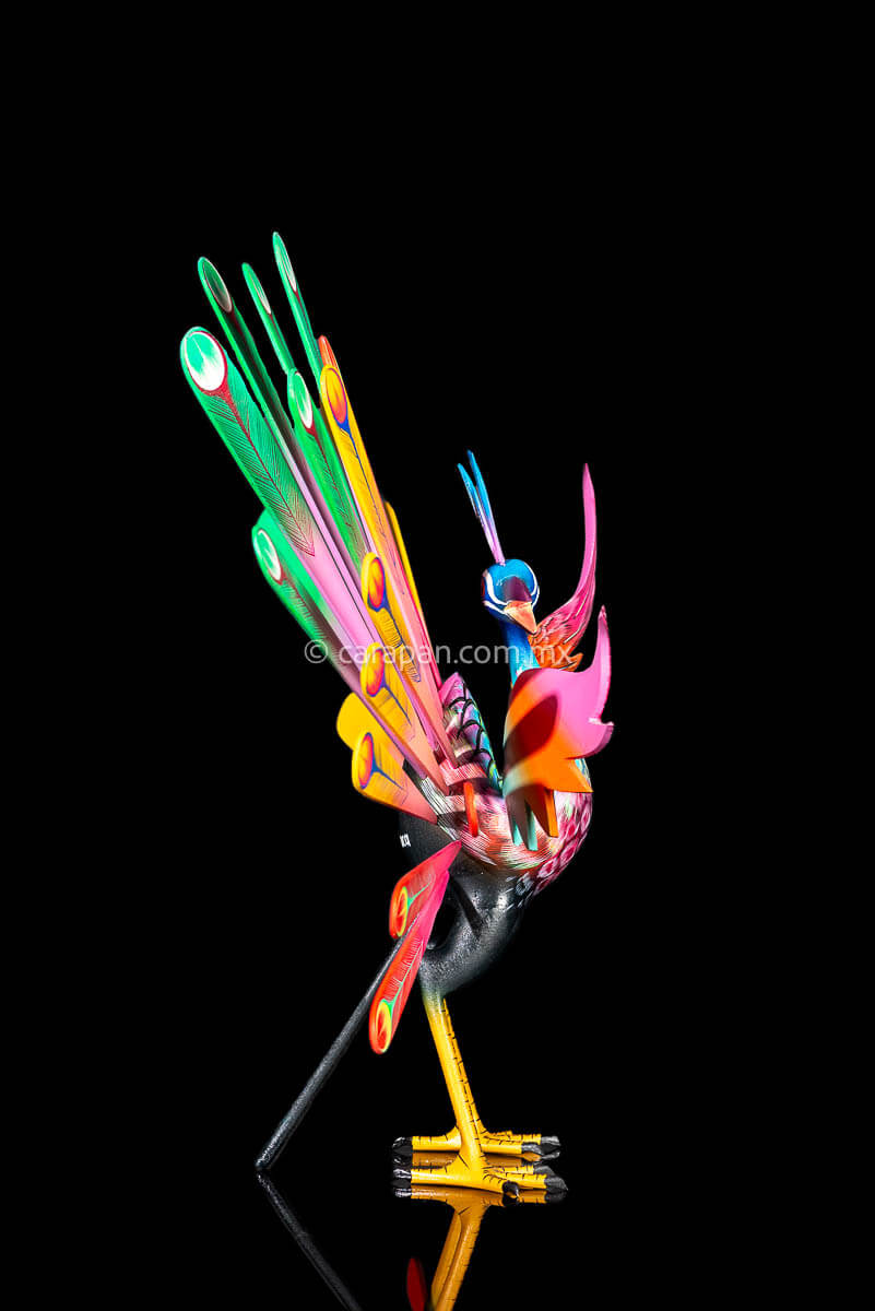 Side of Peacock Wooden Sculpture Handcrafted in Oaxaca Mexico, hand painted displaying multiple colors wings& every feather are detachable