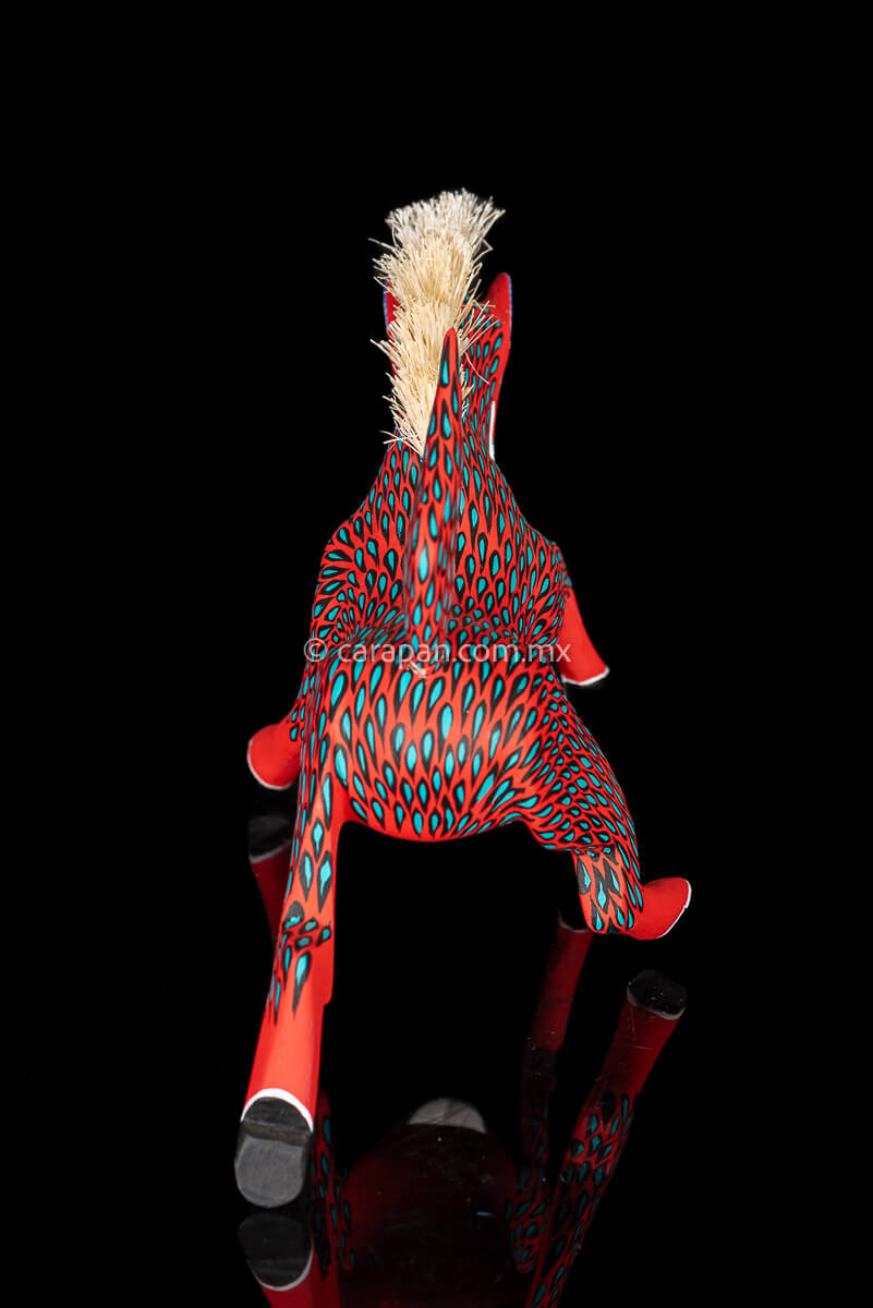 Red Horse Mexican Wood Carving Alebrije hand painted in red with green strokes. Detachable tail