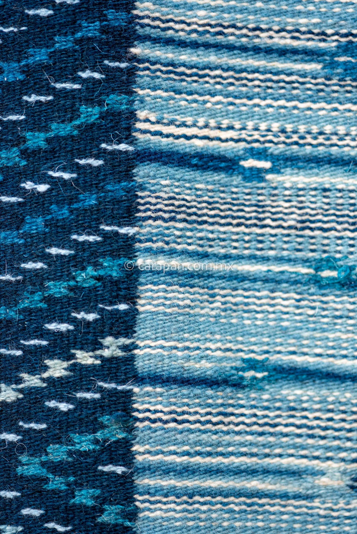 Blue Mexican Sarape made of Wool dyed with Indigo natural pigment decorated with stripes and an oval at the center filled with traditional motifs. Exquisite! 