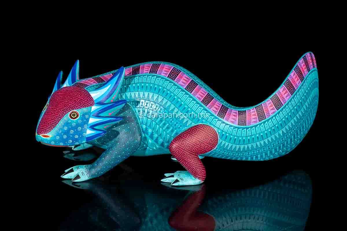 Axolotl Oaxacan wood carving decorated with zapotec symbols in a turquoise & Fucsia palette