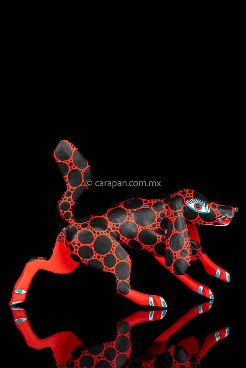 Red dog with round black patches Mexican Wood Carving hand crafted in Oaxaca, Mexico