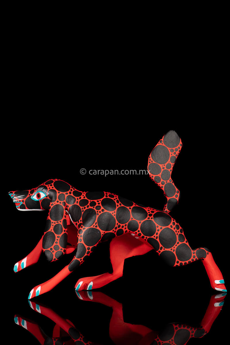 Red dog with round black patches Mexican Wood Carving hand crafted in Oaxaca, Mexico
