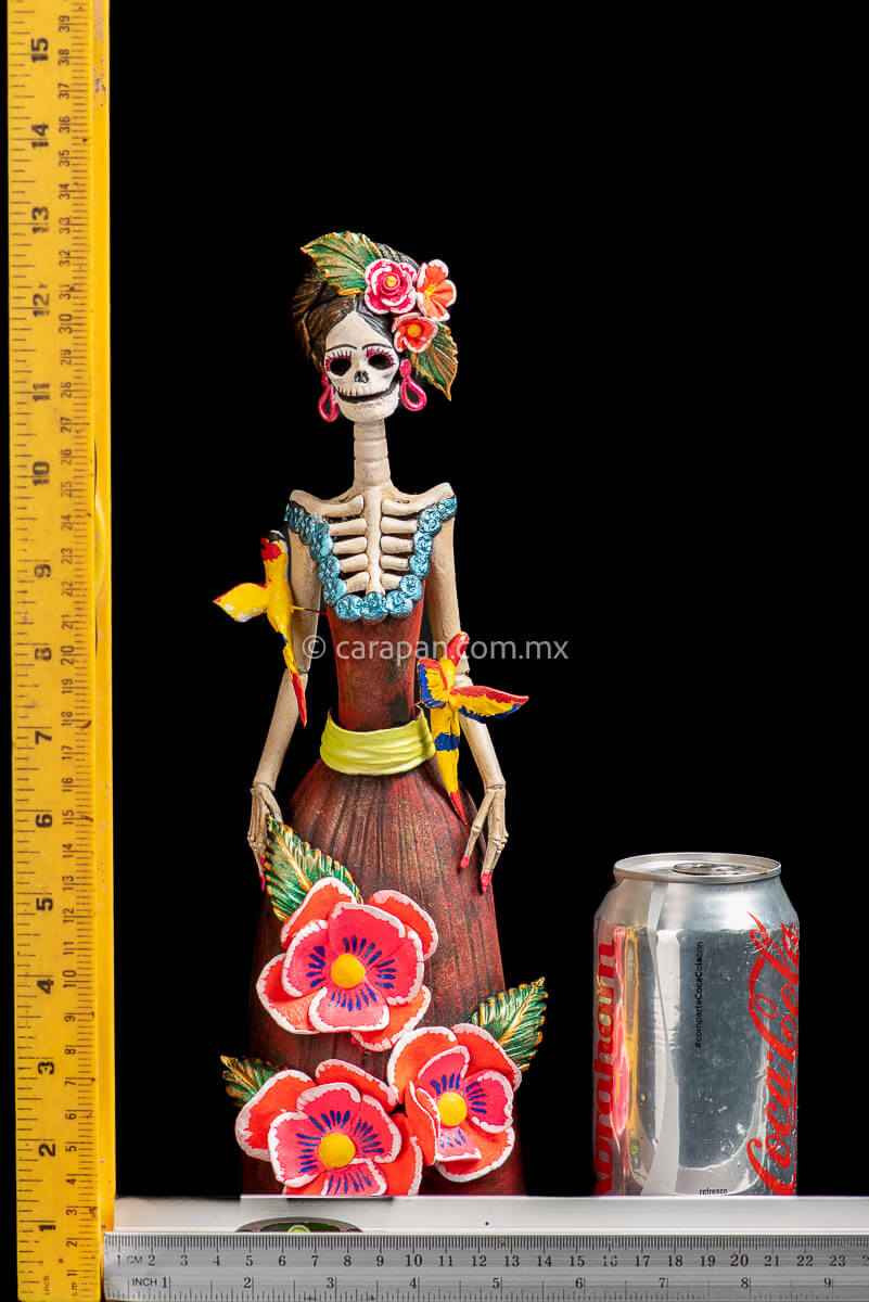 Mexican Clay catrina with parrots and flowers head dress inspired by frida kahlo's style dress with pastillage flowers in pink rulers
