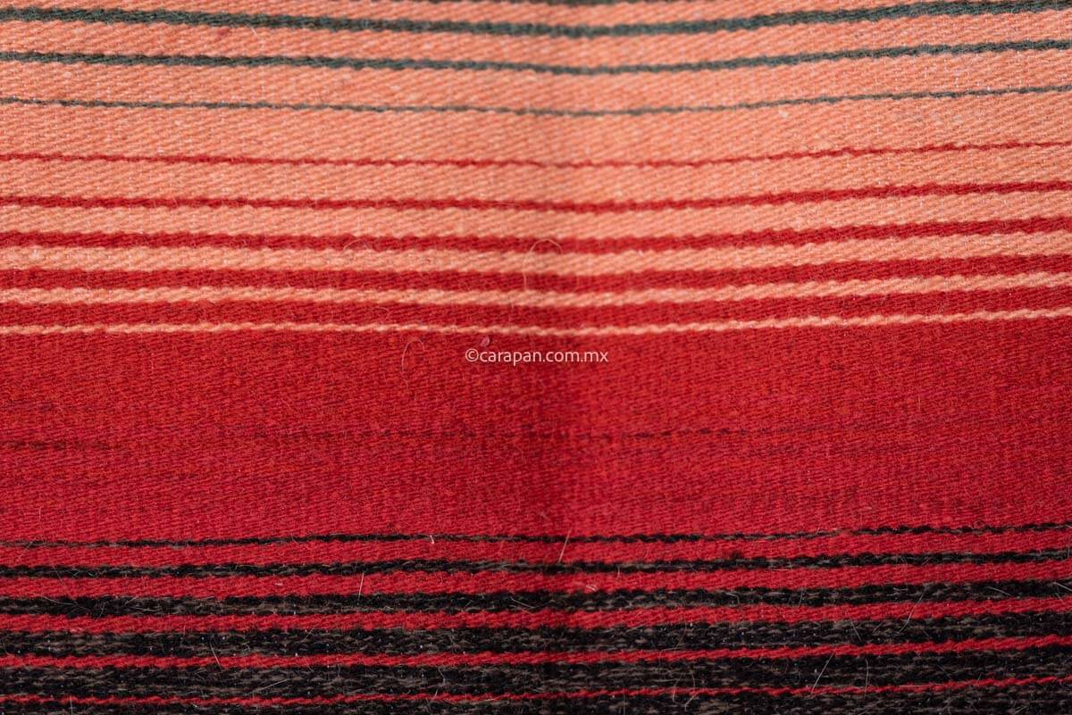 Authentic Mexican Sarape  with diamond in yellow, green and red at center  and faded color stripes  at edges Pedal Loomed  detail