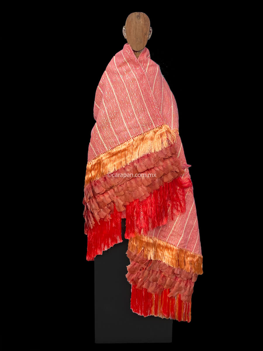 Fine Textile  Crafted by Purepecha Indigenous People using a backstrap loom. melon tone with golden beige stripes and golden sequins. It has rayon tassels and hand knotted melon tone feathers