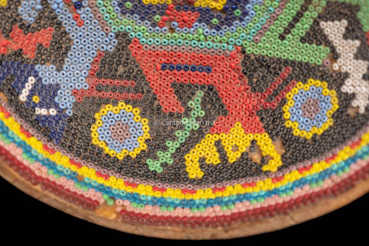 Vintage Huichol Beaded Gourd with Peyote Symbol at the center and 6 deer around it. Crafted with glass beads applied to the gourd over a layer of bees wax with no previous design. 