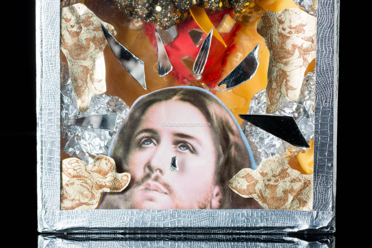 Religious Kitch Art Wooden Box with Sacred Heart of Jesus. The exterior of the box is decorated with fragments of mirror and the interior has a sacred heart created with fabric and mirror fragments. It also has an intervened christ printed image at the bottom.