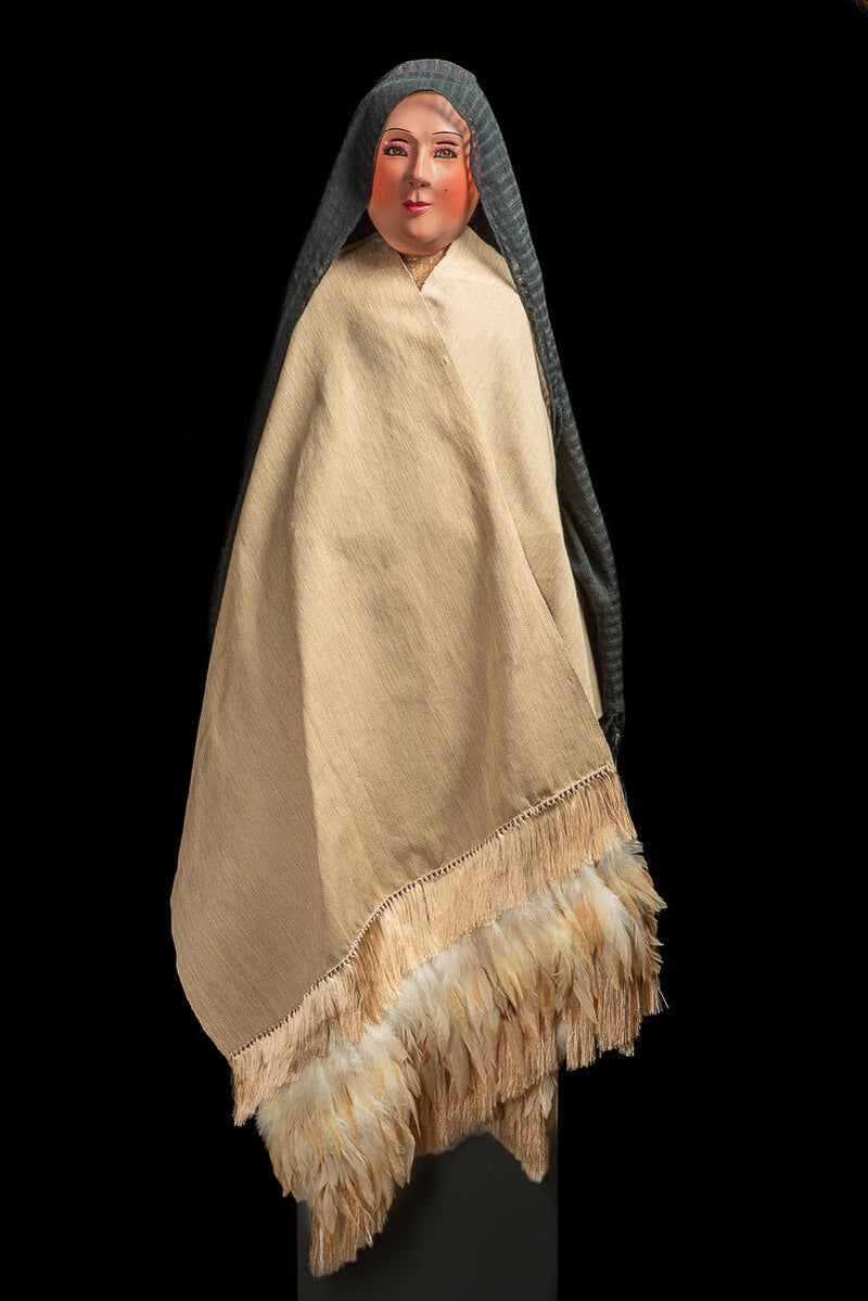 Mexican rebozo with feathers indigenous textile in beige with manequin