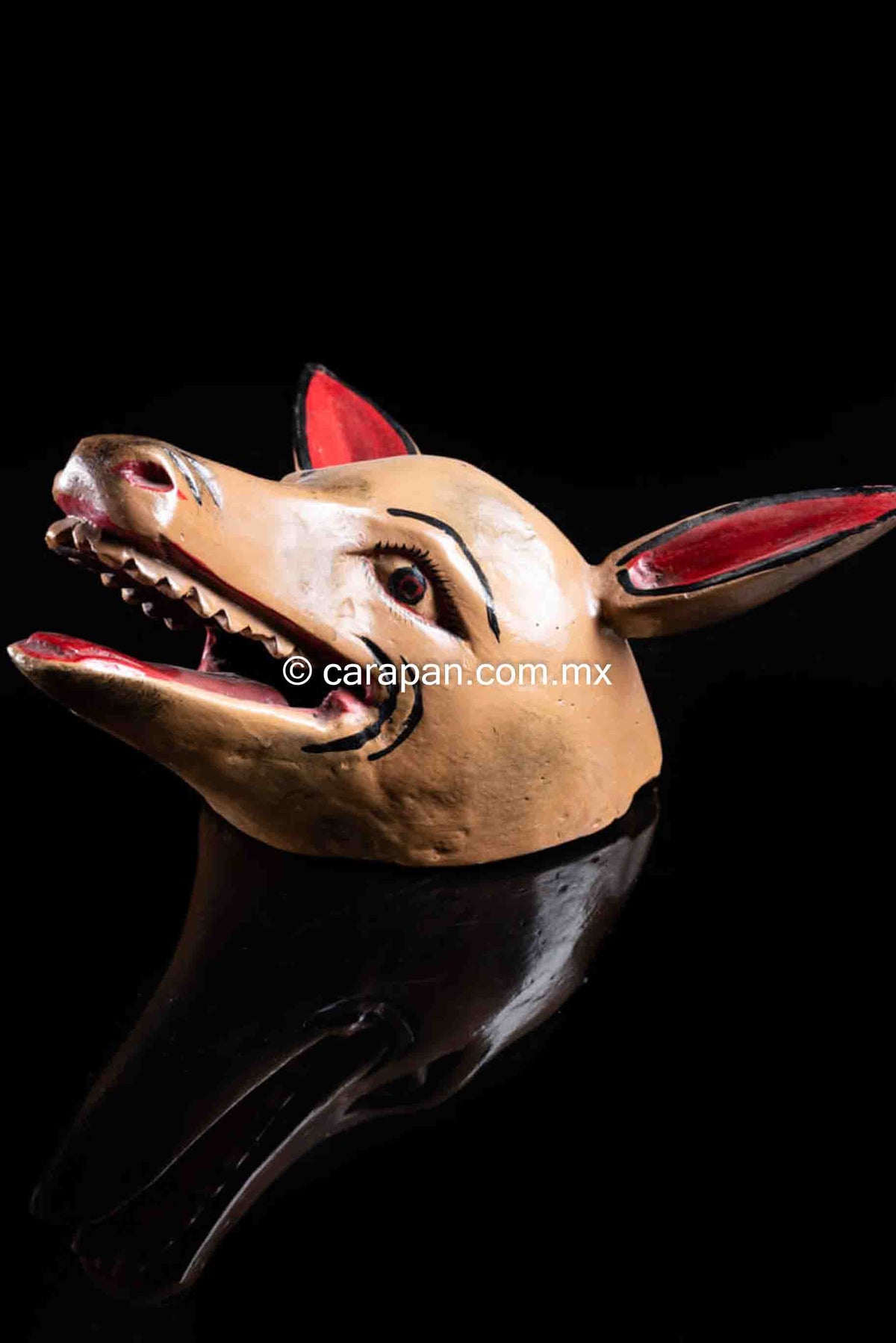 Hand carved Donkey Wood Mask Crafted in Guerrero, México. The donkey is painted in beige with its ears in red. It shows its mouth open