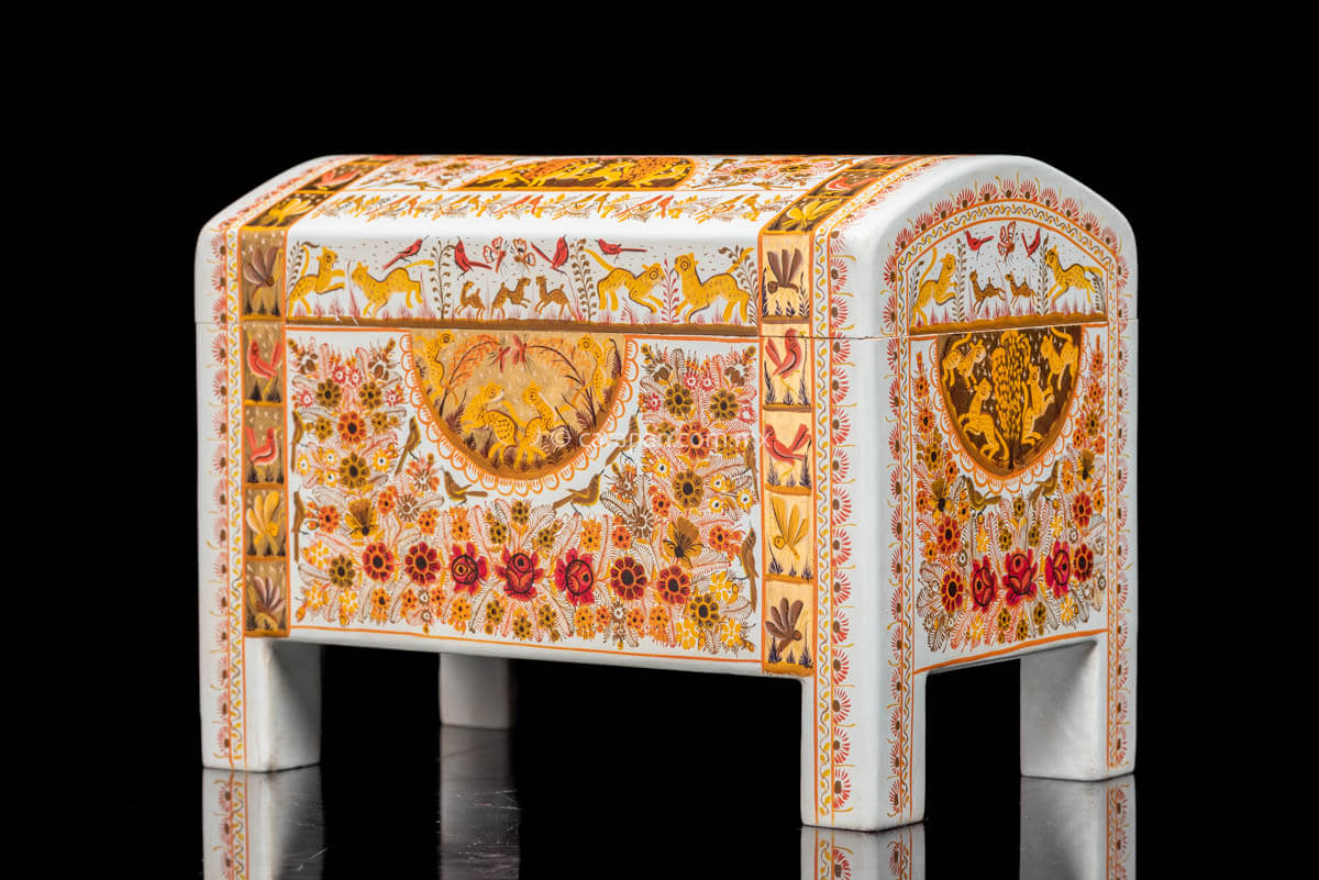 Gold Outlined Lacquered Wood Chest with white background. Decorated with flowers, birds and jaguars