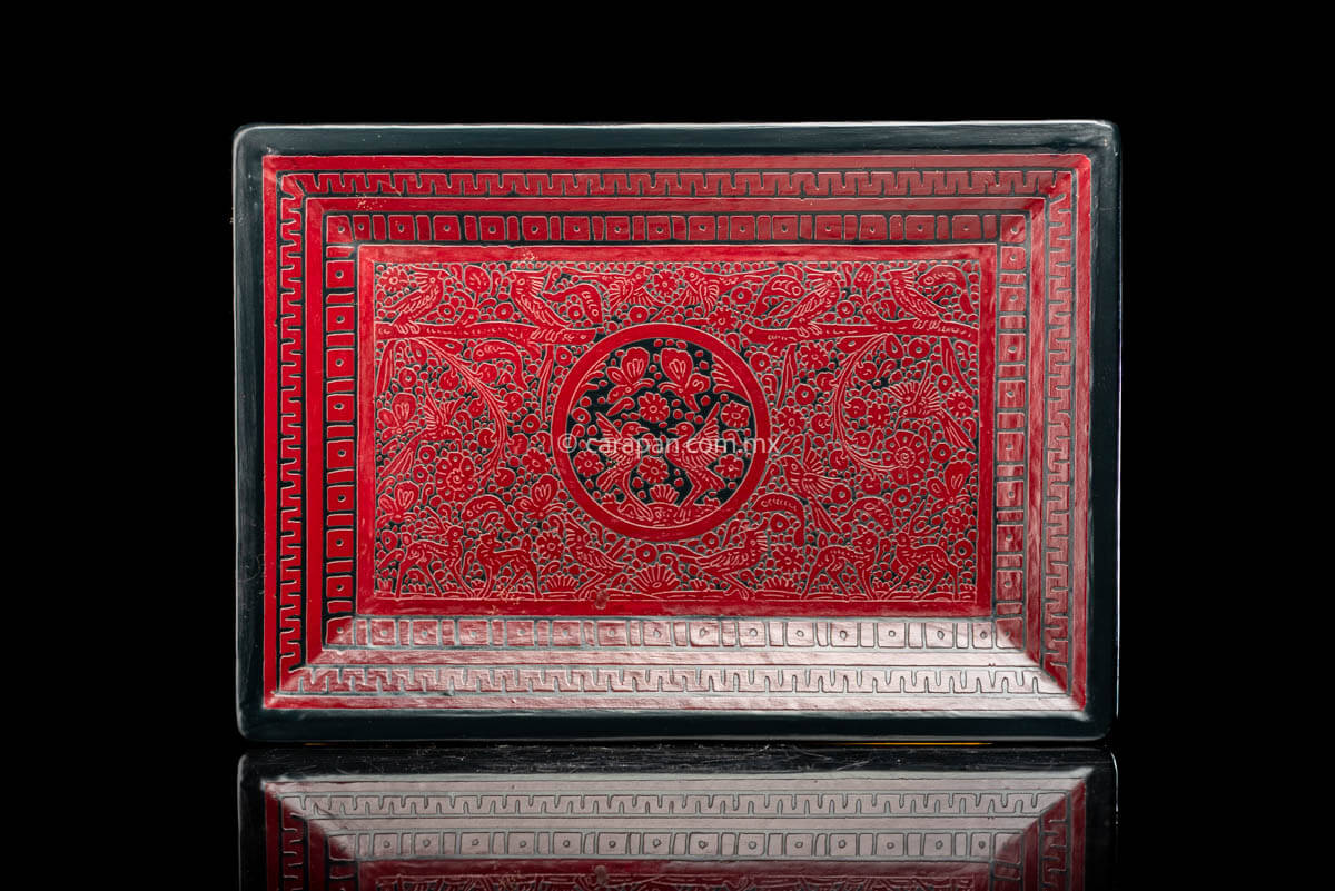 Lacquered Wood Tray in etched red over black decorated profusely with  birds and vegetal motifs. The edge is framed by geometric patterns  with a thin red contour from Olinala Guerrero