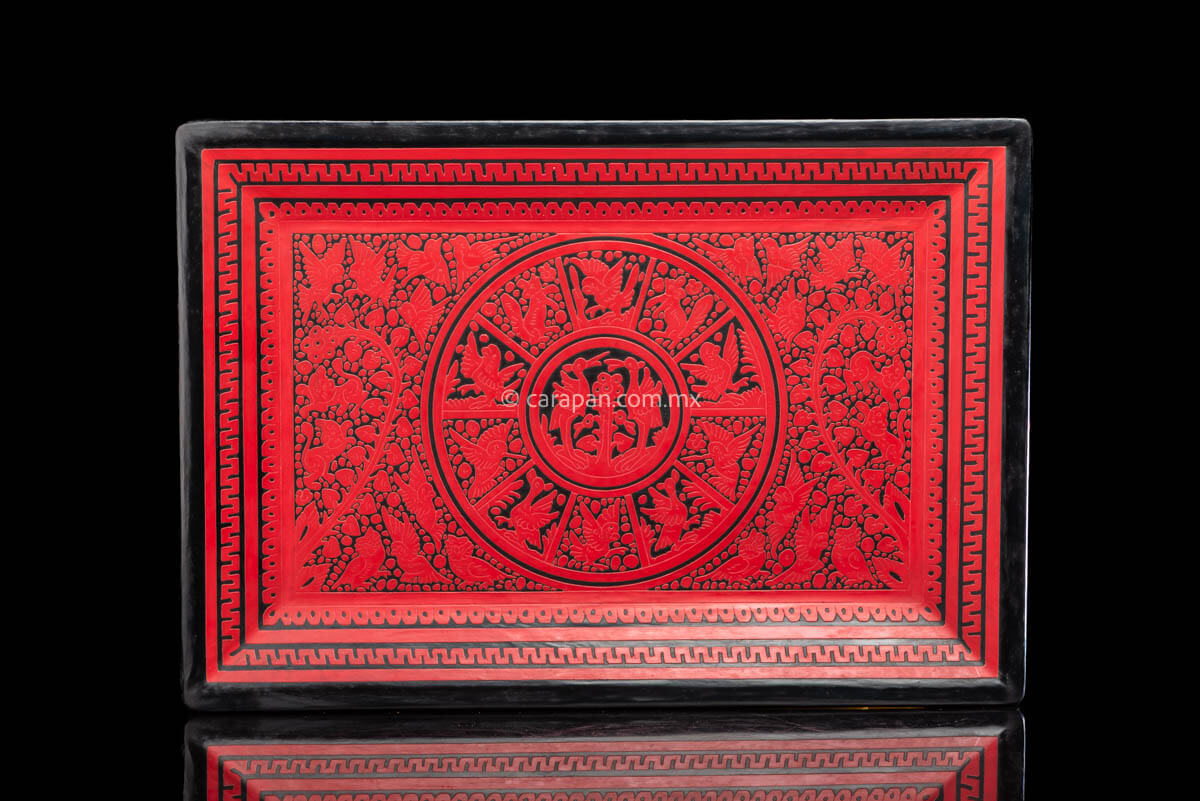 Lacquered wood tray etched red over black with birds and vegetal motifs