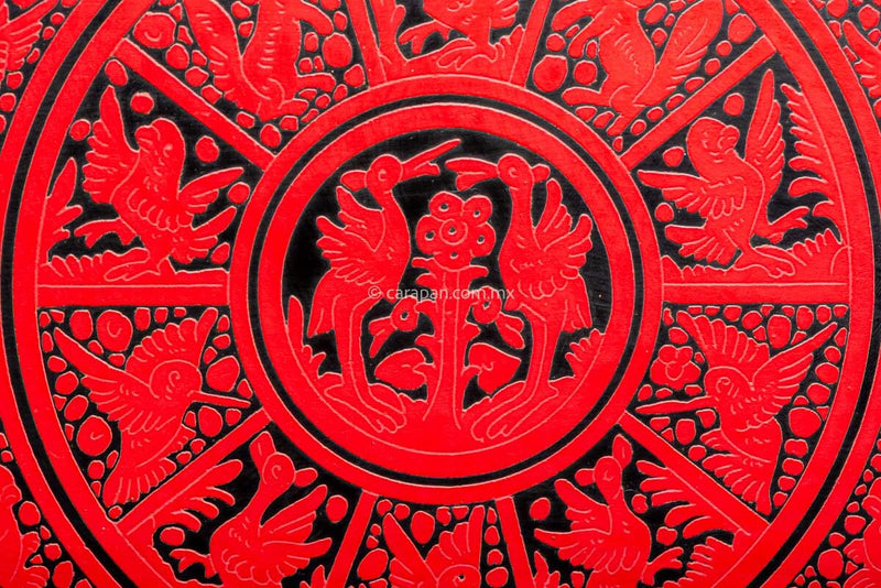 Lacquered wood tray etched red over black with birds and vegetal motifs