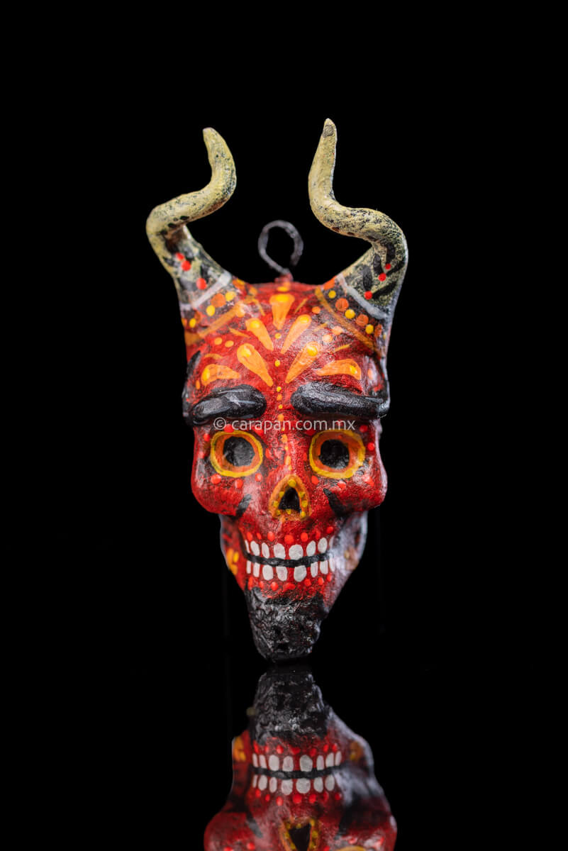 Smiling Paper Mache devil Head with White Horns Painted in red with orange strokes