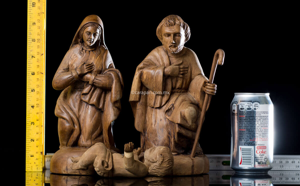 Nativity Set Joseph, Mary and Baby Jesus. Each figure was hand carved in wood. Joseph and Mary have the same polished style while baby jesus figure displays a different natural wood style. It is possible that the latter came from another nativity, however the ensemble looks beautiful. rulers