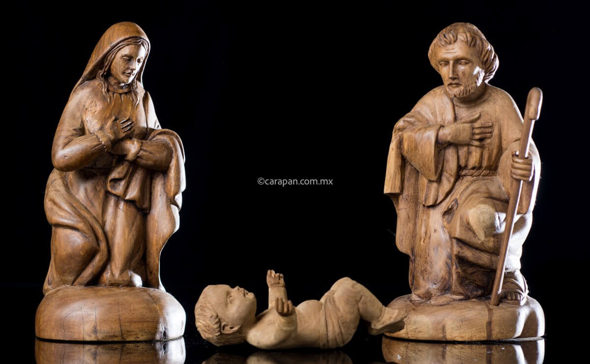 Nativity Set Joseph, Mary and Baby Jesus. Each figure was hand carved in wood. Joseph and Mary have the same polished style while baby jesus figure displays a different natural wood style. It is possible that the latter came from another nativity, however the ensemble looks beautiful.