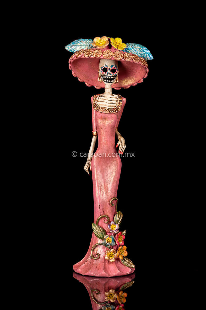 Day of the dead Sculpture, Catrina wearing a pink dress with flowers at the bottom and a traditional Posada Style hat