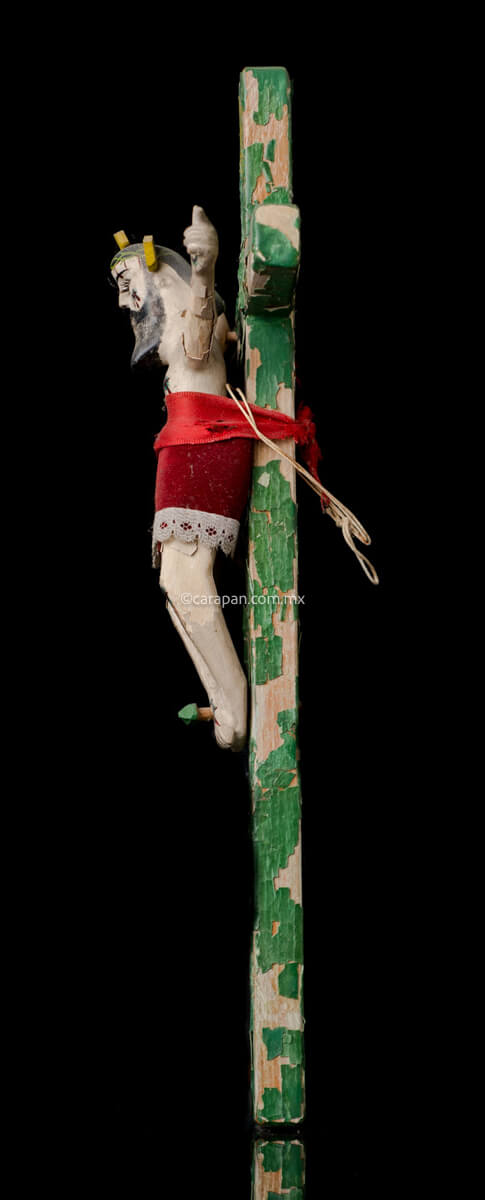 Vintage Lacquered Wood Cross with Christ Crafted in Olinalá, Guerrero. The cross is green The lacquer presents some peeled off areas. The christ wears a red cloth from the waist to his knees.  Side